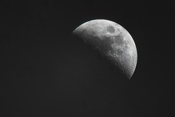 The moon's surface is clearly visible with craters and maria illuminated by sunlight in this astronomical observation © Damyan Petkov