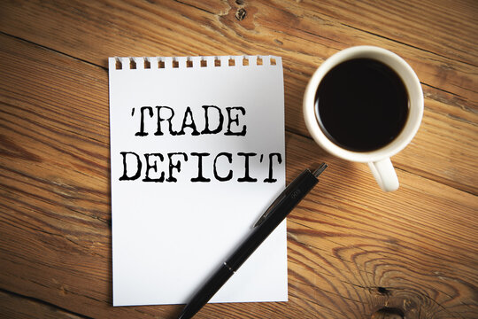 Trade deficit on white paper background