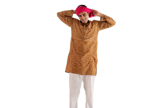 Portrait of a farmer tying cloth on his head