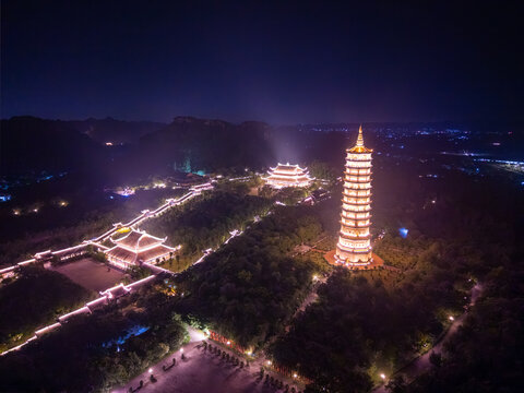 Aerial view of Bai Dinh pagoda and mountains at night in Ninh Binh province, Vietnam