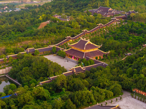 Aerial view of Bai Dinh pagoda and mountains at sunset in Ninh Binh province, Vietnam