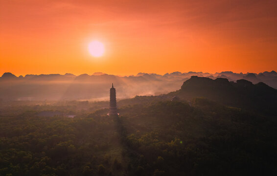 Aerial view of Bai Dinh pagoda and mountains at sunset in Ninh Binh province, Vietnam