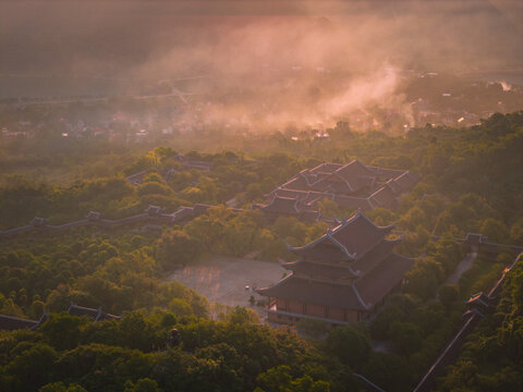 Aerial view of Bai Dinh pagoda and mountains at sunset in Ninh Binh province, Vietnam