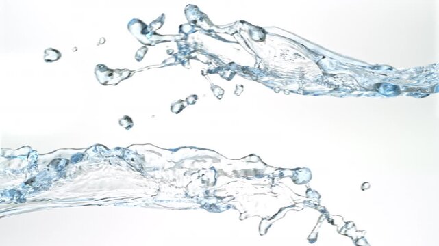 Super Slow Motion Shot of Flying Water Splashes Isolated on White Background at 1000fps.