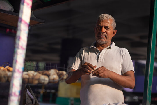 Male vendor making dough for litti at his roadside food stall