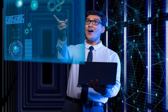 Excited businessman using laptop touching on virtual screen