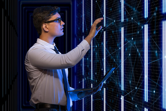 Technician working on the server in the data storage room. 