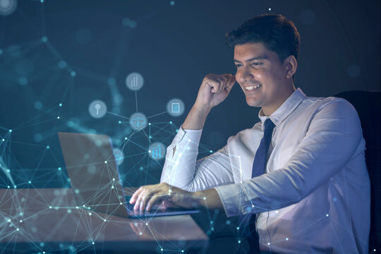 Businessman working on laptop computer with icons on virtual screen