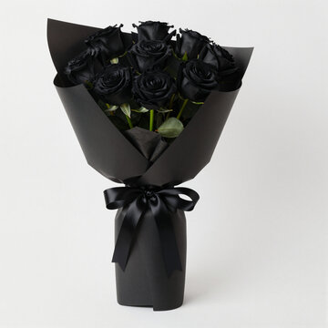 elegant bouquet of black roses in dark wrapping symbolizing elegance, mystery and gothic aesthetics