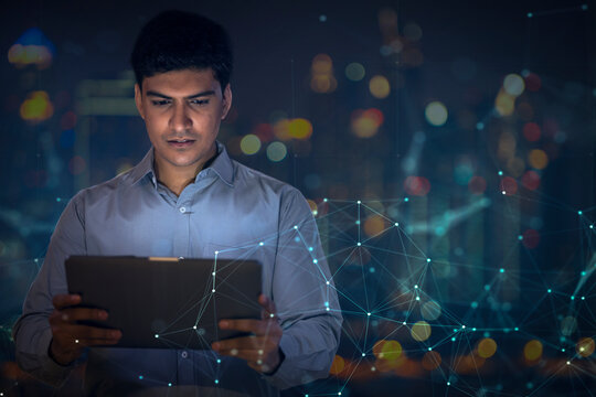 Digital Composite Image Of Businessman Using a digital tablet