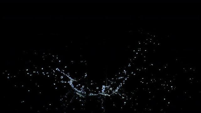 Super Slow Motion Shot of Water Crown Splash Isolated on Black Background at 1000fps.