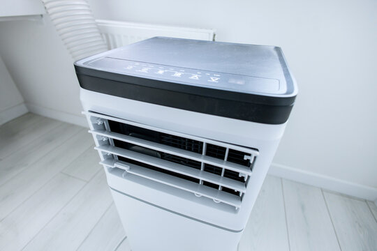Extreme macro close-up of open adjustable louvers on modern mobile monoblock air conditioner unit