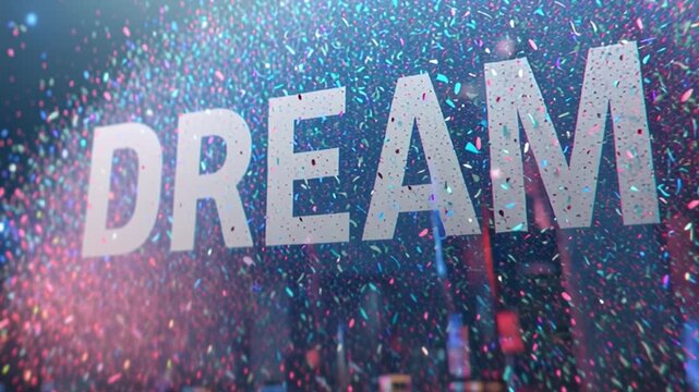 Words like Dream Big stand out in bold letters among a swirl of colorful particles. This vibrant scene highlights texture and energy in a dynamic setting during a nighttime city backdrop.