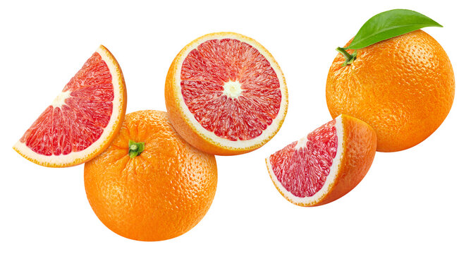 Levitating red orange halves and slices. Falling orange isolated white background