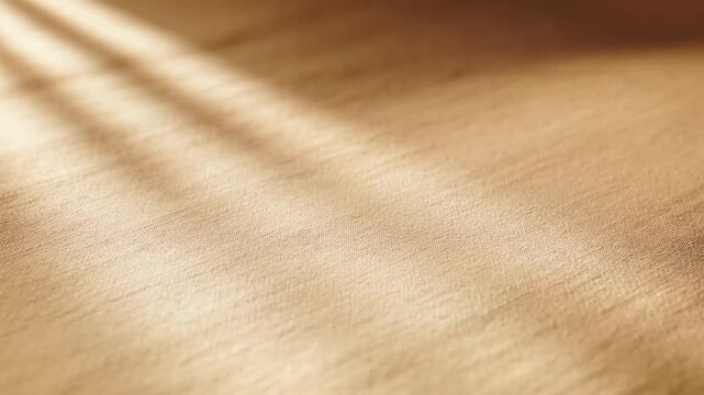 Golden light beams casting diagonal shadows on a warm wooden floor texture background