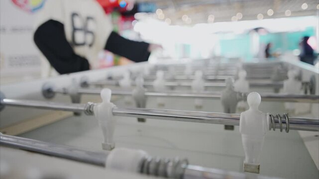 Teenagers Skillfully Spin Foosball Rods, Scoring Goals With Perfect Control At The Table