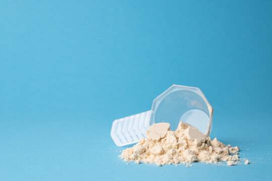 Vegan protein powder on a blue background