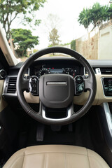 Naklejka premium Range Rover Sport Steering wheel and digital dashboard view, Luxury SUV interior driver perspective