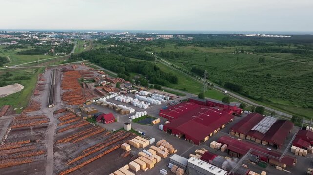 Aerial panorama of timber processing facility with railway and Ventspils Port on the Baltic Sea Latvia