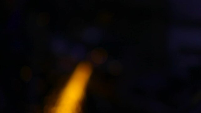 Defocused shooting of sparks. Not the exact background. A blurry sheaf of sparks. Abstract texture in motion.