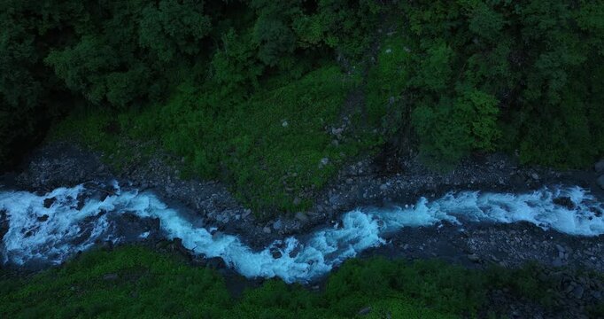 Aerial footage of beautiful high altitude grassland and mountain landscape	