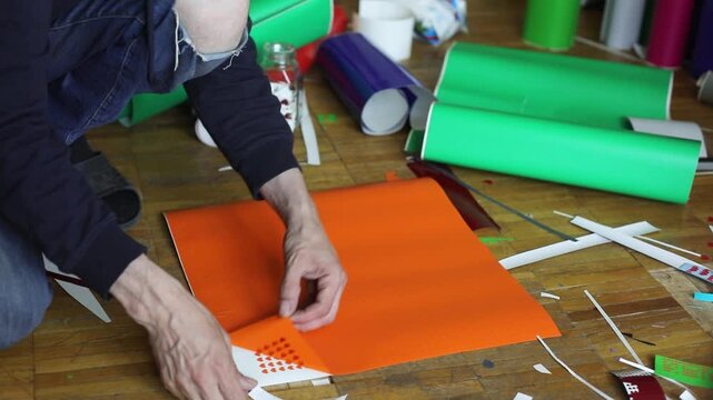 Vinyl Film. Large Sticker. Separating film from paper. Creating a Sticker.