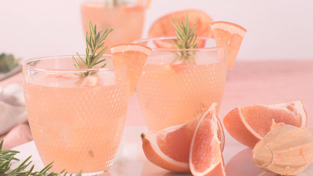 Grapefruit cocktails with rosemary sprig