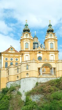 Scenic view of the majestic baroque Melk Abbey monastery on a rocky hill, Austria