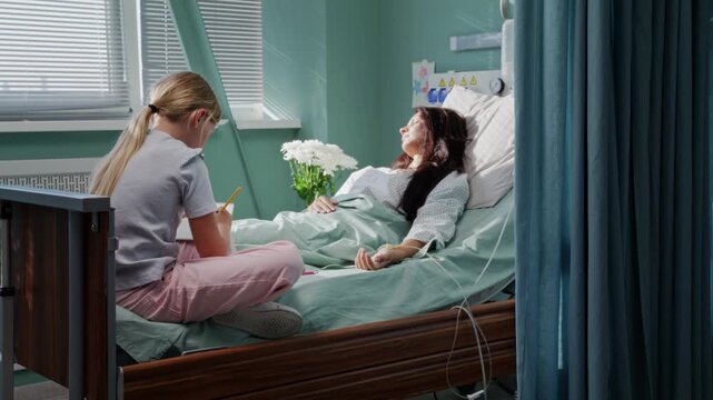 Girl creates drawing near lying mother during hospital recovery
