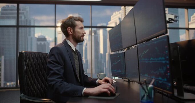 Stockbroker at a Desk Studies Market Charts on Multiple Monitors, Analyzing Investment Data, Price Trends and Trading Signals for Portfolio Decisions in Professional Finance Office.