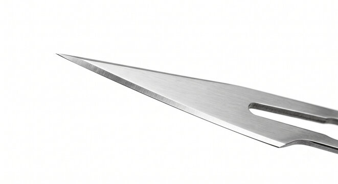 Extreme macro of a flawless stainless steel surgical scalpel blade tip. Highly polished cutting edge isolated on a white background.
