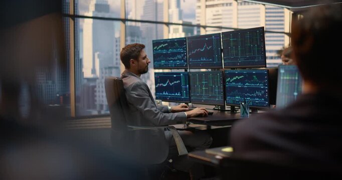 Stockbrokers with Monitors Multiple Computer Screens Displaying Stock Exchange at Office Desk, Financial Charts, Market Data, Trading Analytics Portfolio Growth, Profit. Static Shot Asset Management