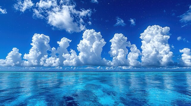 Azure ocean meets the cloud filled blue sky