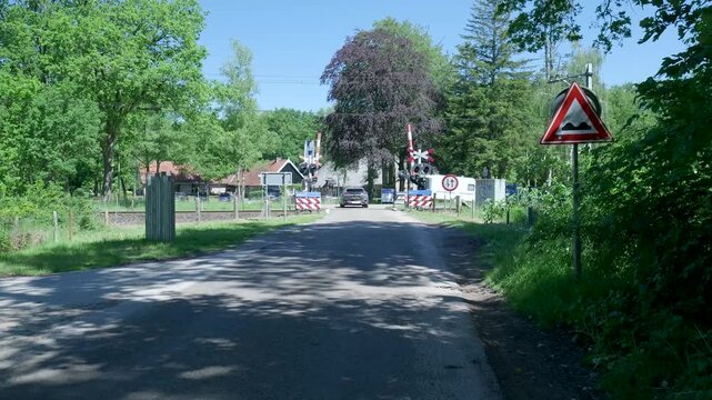Driving towards a quiet rural railroad crossing