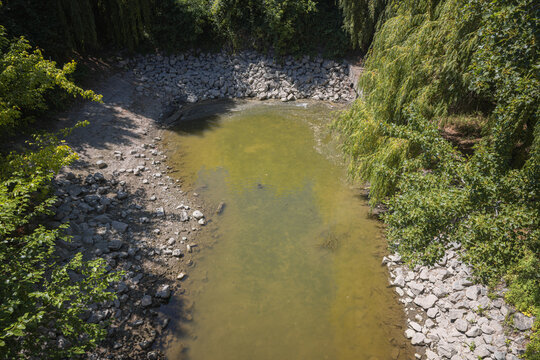 Dry riverbed showing drought conditions with low water