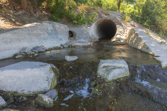 Large round sewage outlet contributing to coastal pollution
