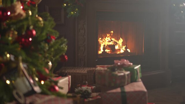 Classical Christmas decorated interior living room library with fireplace. Christmas tree with red golden ornament decorations. Modern classic style interior design apartment. Christmas eve at home