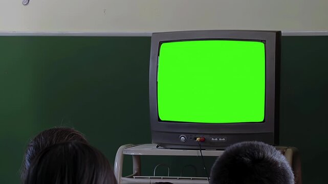 Students Watching Old TV with Green Screen in Classroom - 4K