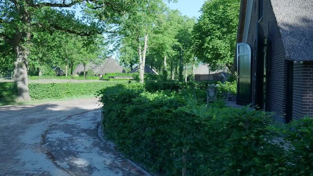 Walking down a picturesque paved path in the historic village of orvelte