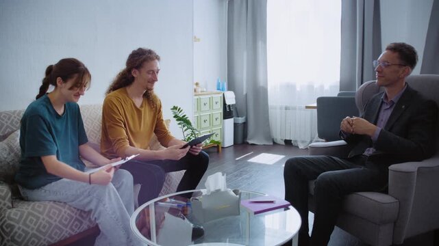 Professional sharing testing materials with a couple before starting their meeting