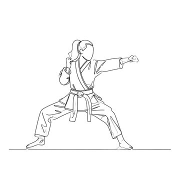 A female martial artist in a fighting stance with one arm extended