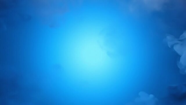Dark grey fog clearing from the center to reveal a bright blue light for mental clarity