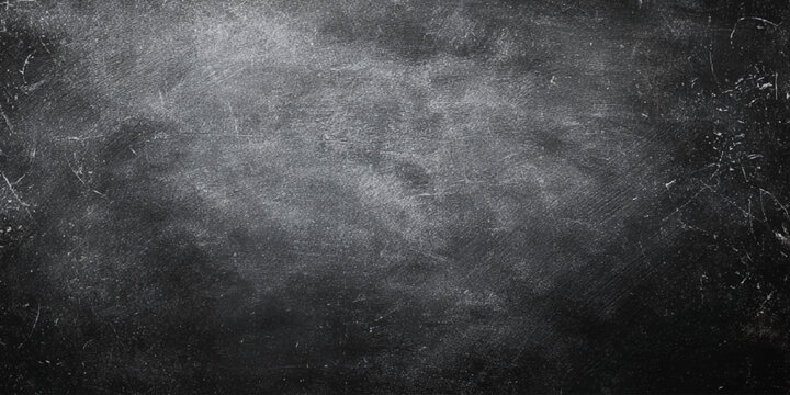 Scratched and worn blackboard surface with white chalk smudges and marks