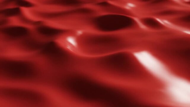 Deep red abstract liquid surface undulating with smooth glossy texture for powerful visual energy