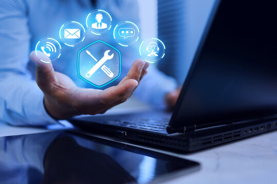 technical support concept with a businessman holding torque wrench represents service information or after sale service such as repair, newsletter email, question and answer, on site services