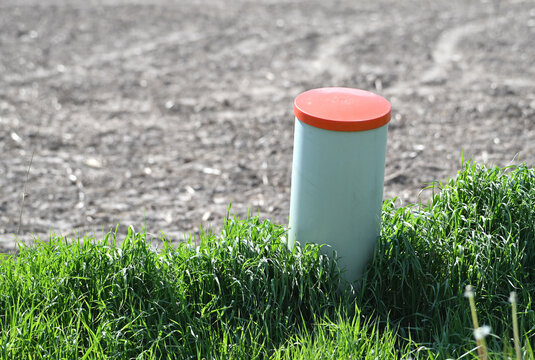 White Can Marker in Farm Field
