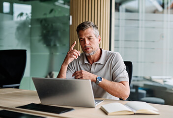Fototapeta premium Portrait of a young businessman or a young entrepreneur or a student young woman working on tablet or laptop computer working in office