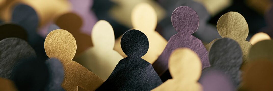Close-up textured paper crowd of diverse human figures in gold black and muted tones for social unity background and community banner design