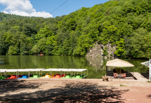Green mountains and boat station on Lake Parz in Dilijan National Park, Armenia.