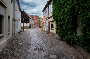 Fototapeta premium Colorful half‑timbered houses along Heiligegeiststraße II – Wittstock, Brandenburg, Germany